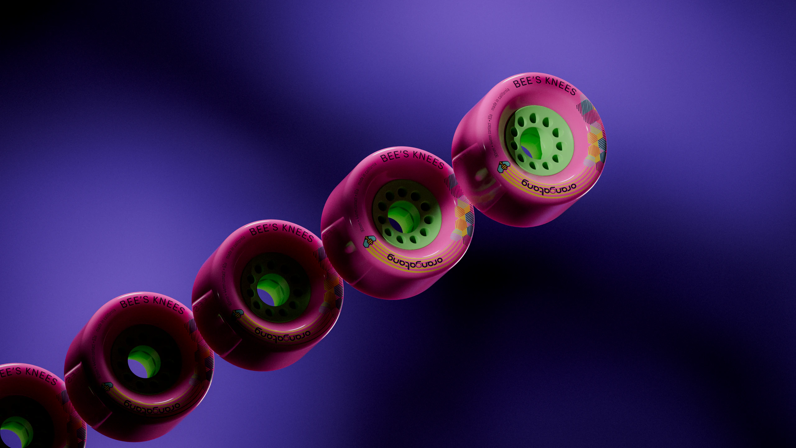 A diagonal row of pink Bee's Knees wheels with green cores