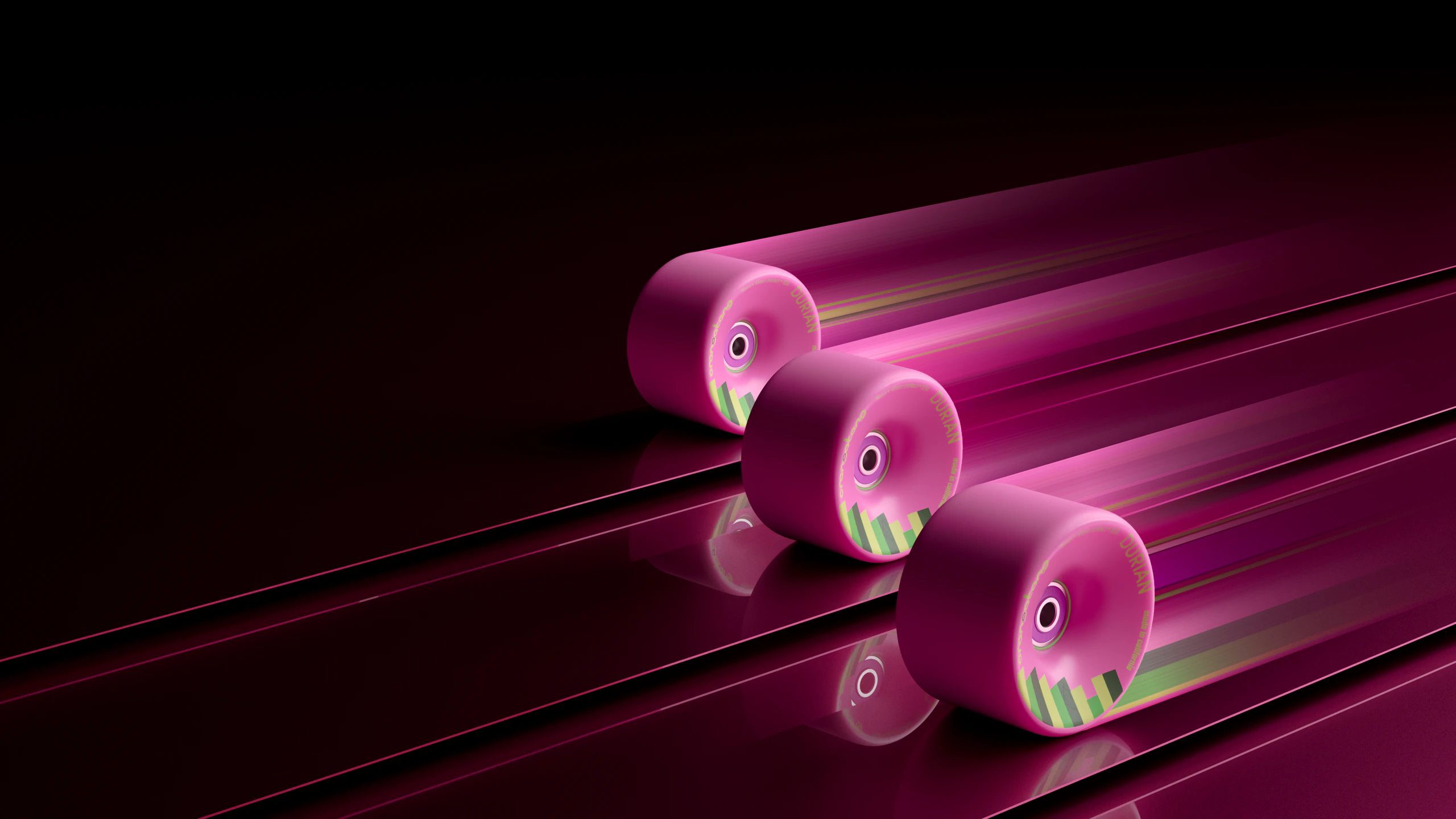 Three Orangatang Durian wheels racing along glossy rails with speed trails
